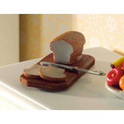 BREAD AND KNIFE ON A BOARD