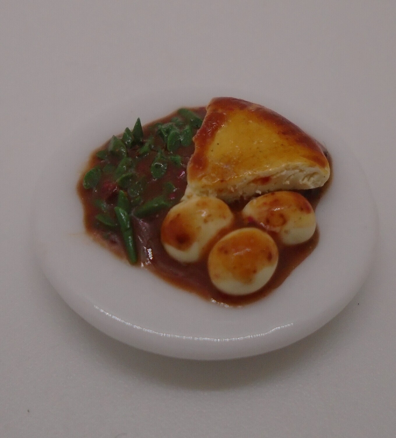 PIE, POTATOES AND GREENS SMOTHERED IN GRAVY