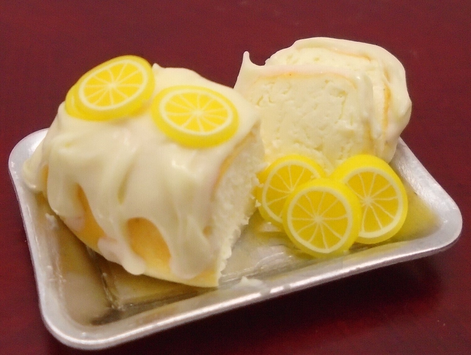 LEMON DRIZZLE CAKE WITH SLICES ON METAL TRAY