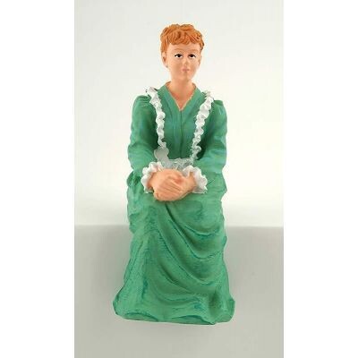 VICTORIAN LADY SITTING IN GREEN