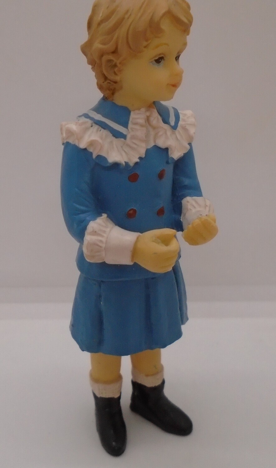 YOUNG GIRL IN BLUE SKIRT AND JACKET