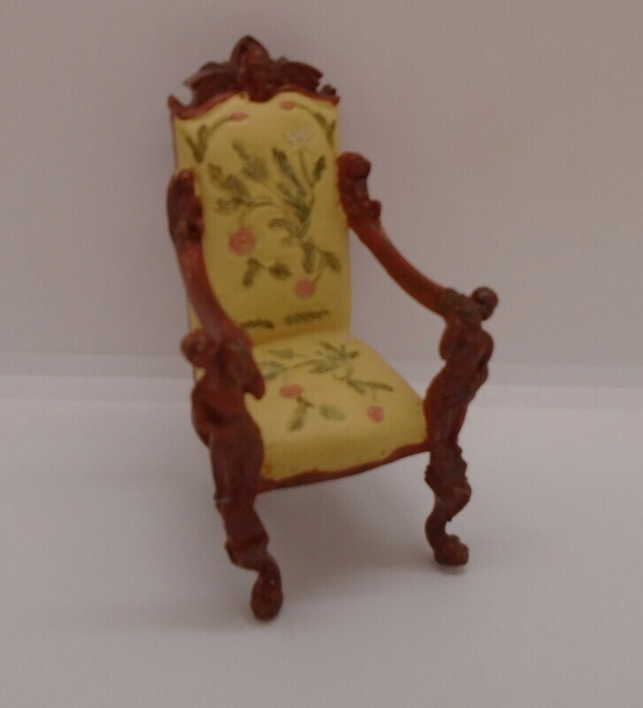 CHAIR WITH ORNATE FIGURES