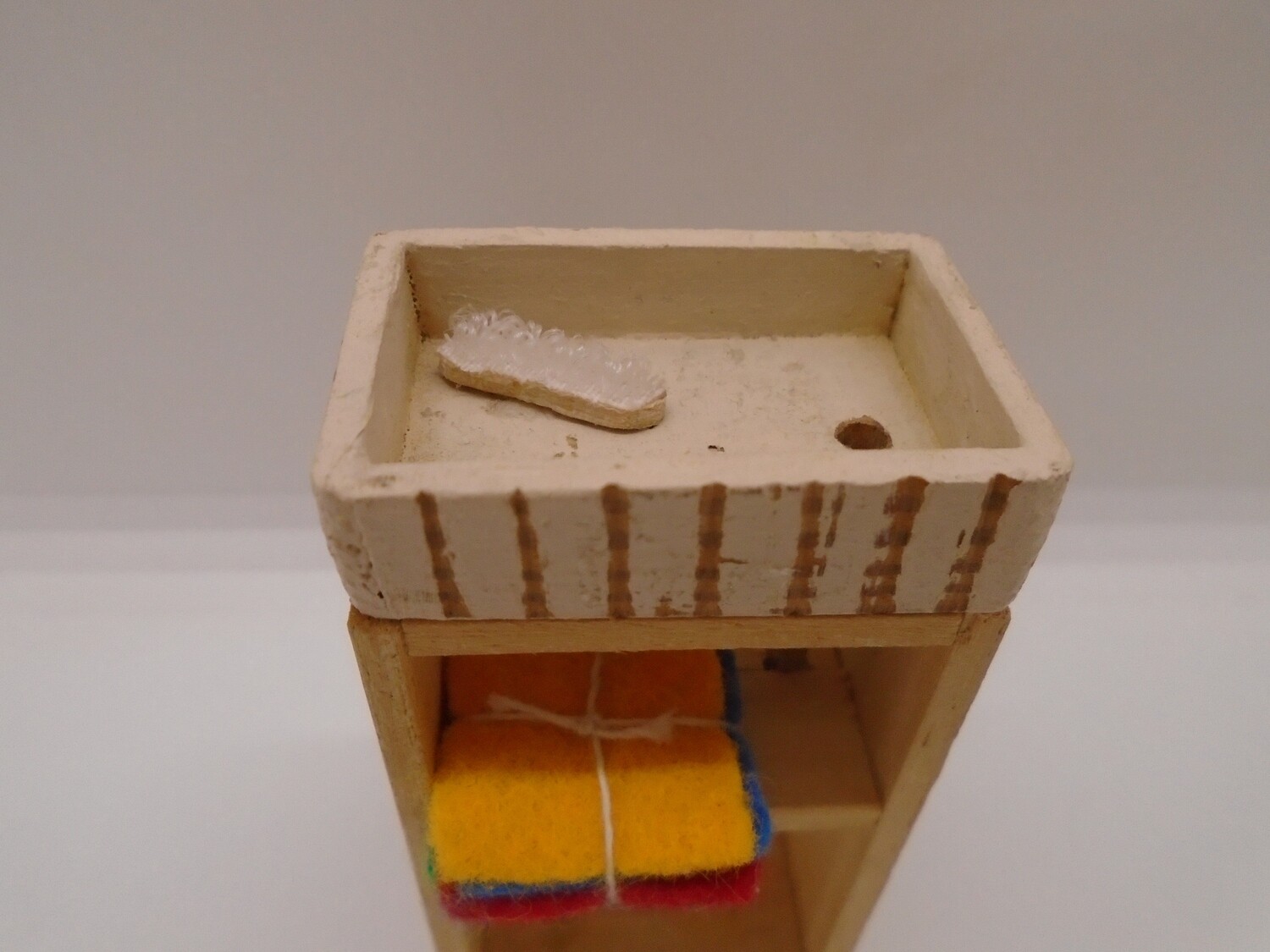 SMALL DRESSED SINK UNIT WITH PIPEWORK