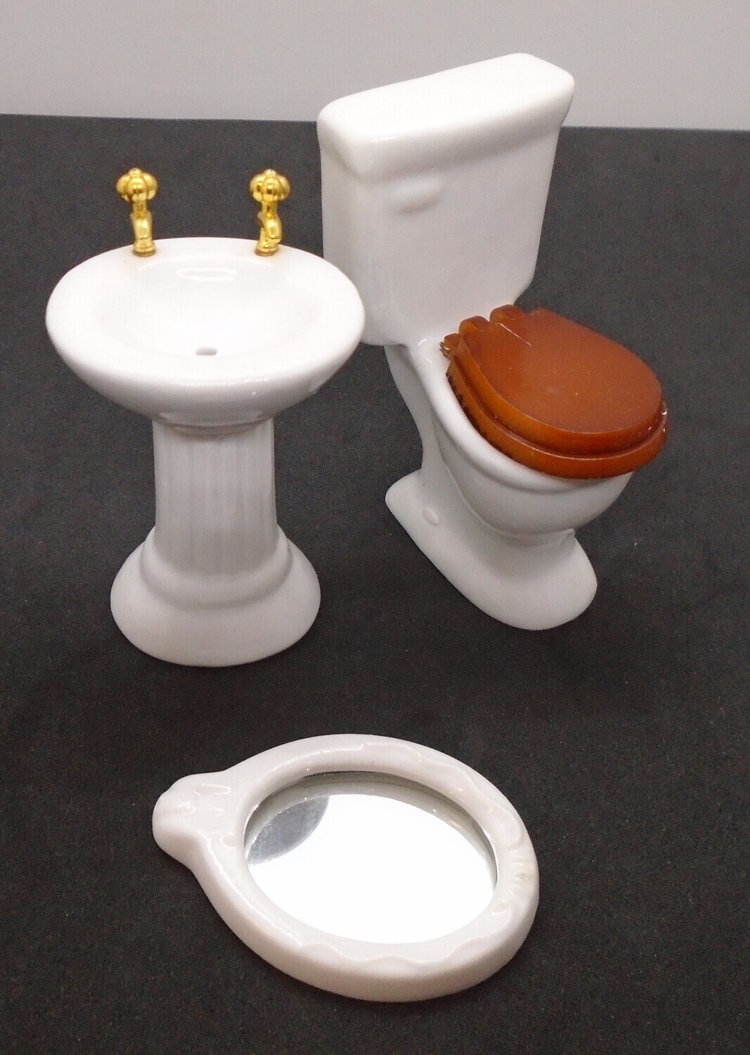 TOILET, SINK, MIRROR IN WHITE CHINA