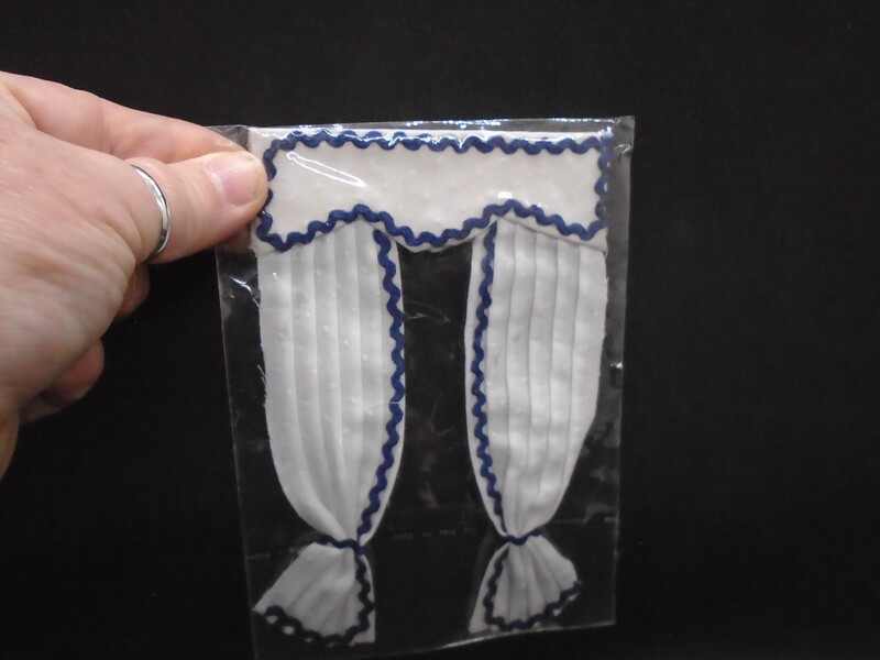 WHITE CURTAINS WITH BLUE TRIM