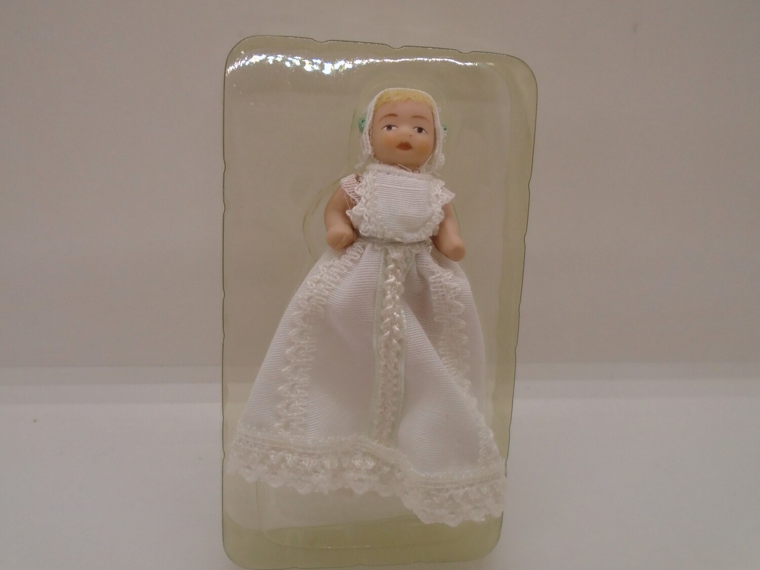 BABY IN CHRISTENING GOWN