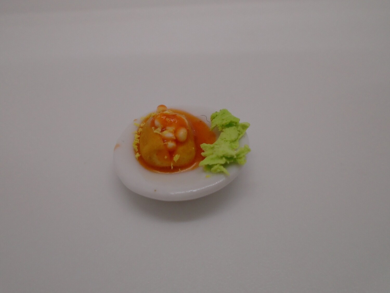 JACKET POTATO WITH CHEESE AND BEANS ON CHINA PLATE