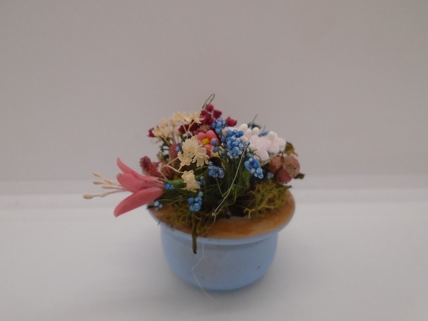 FLOWER DISPLAY IN BLUE POT/PLANTER