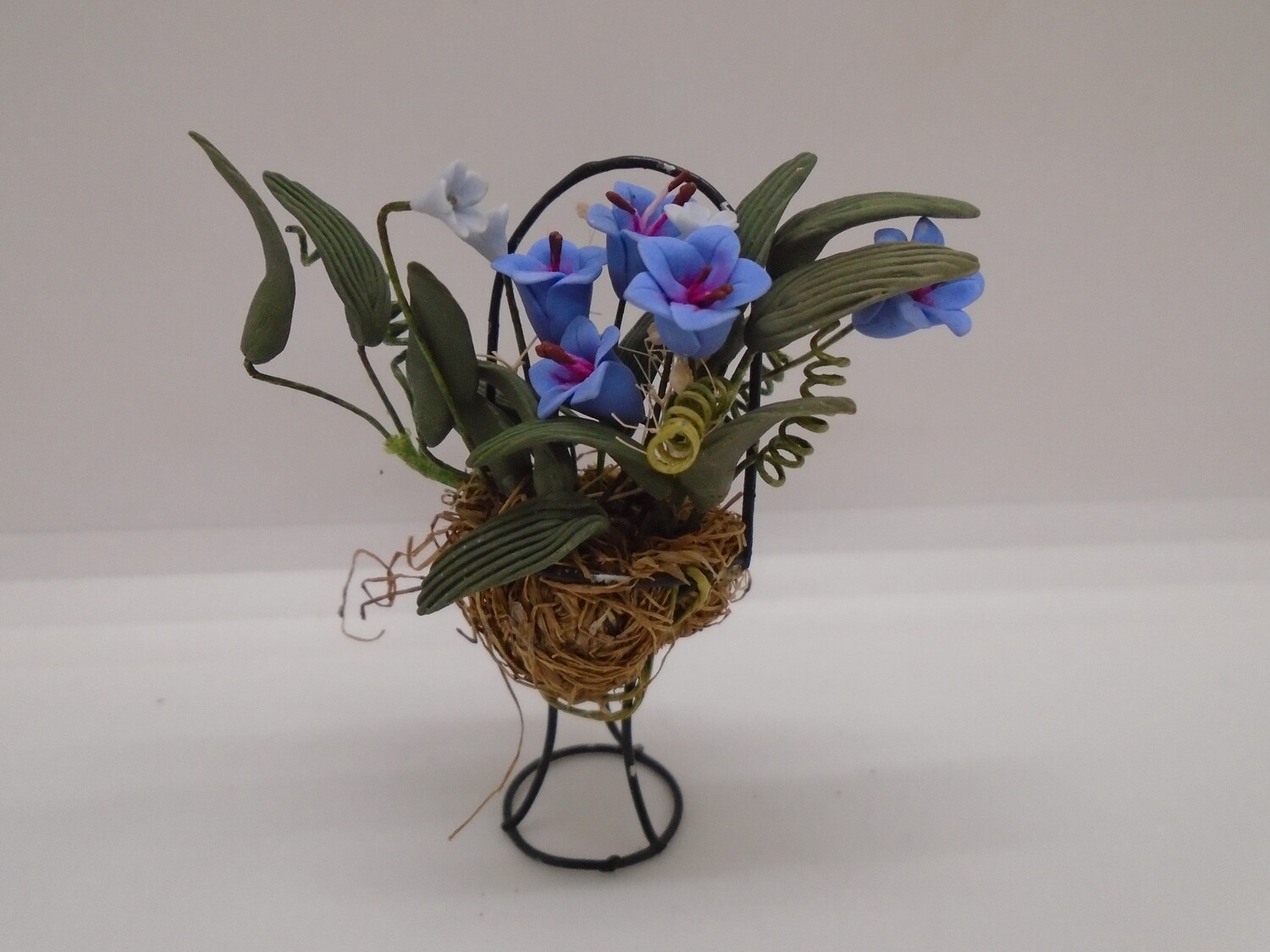 METAL PLANTER DISPLAY WITH PORCELAIN FLOWERS