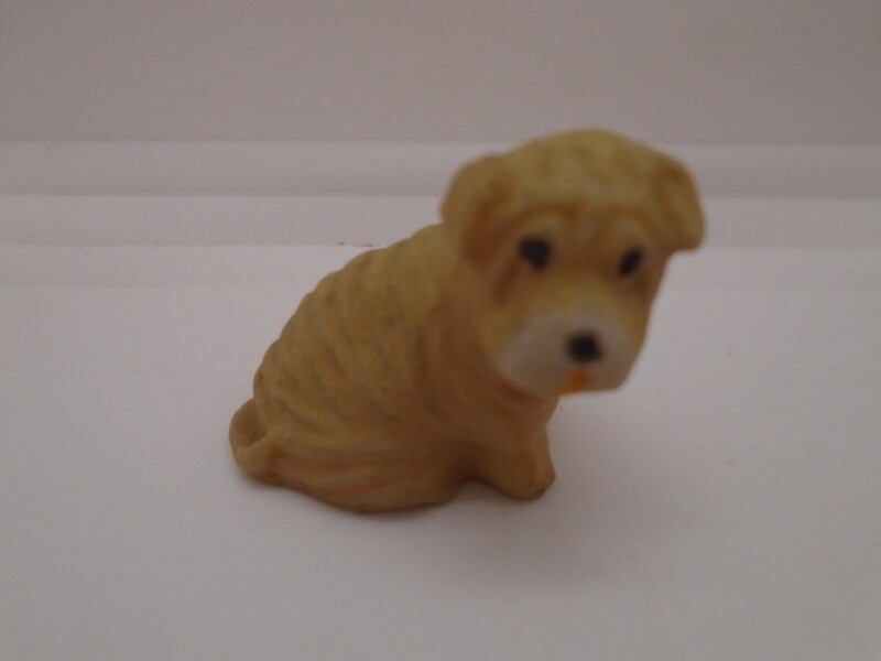 SITTING SHARPEI DOG