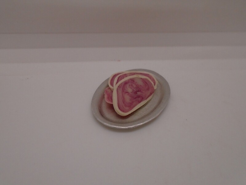 PLATE OF SLICED MEAT