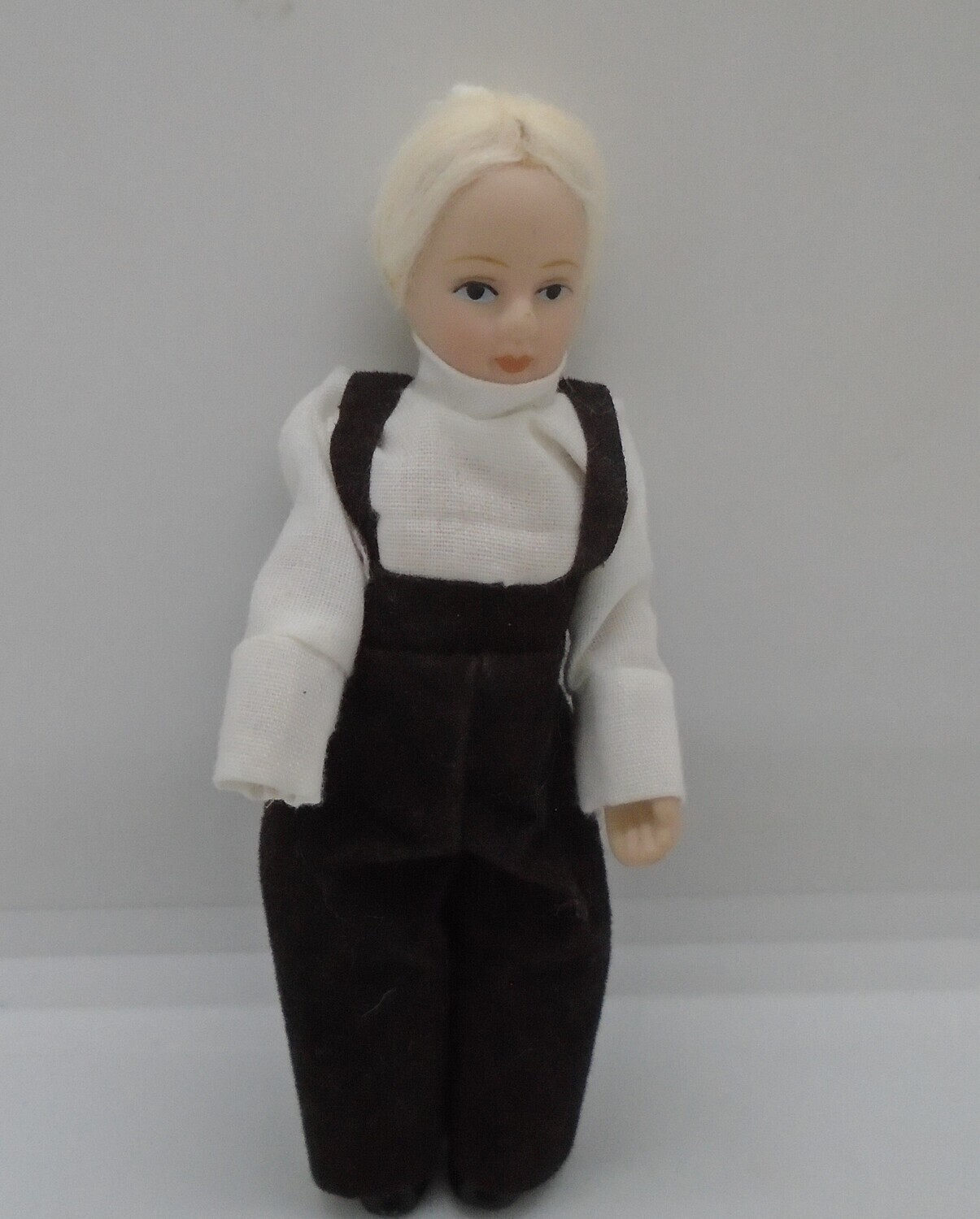 BOY IN BLACK TROUSERS AND BRACES