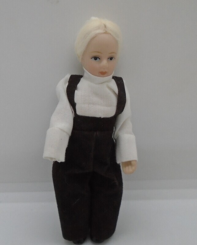 BOY IN BLACK TROUSERS AND BRACES