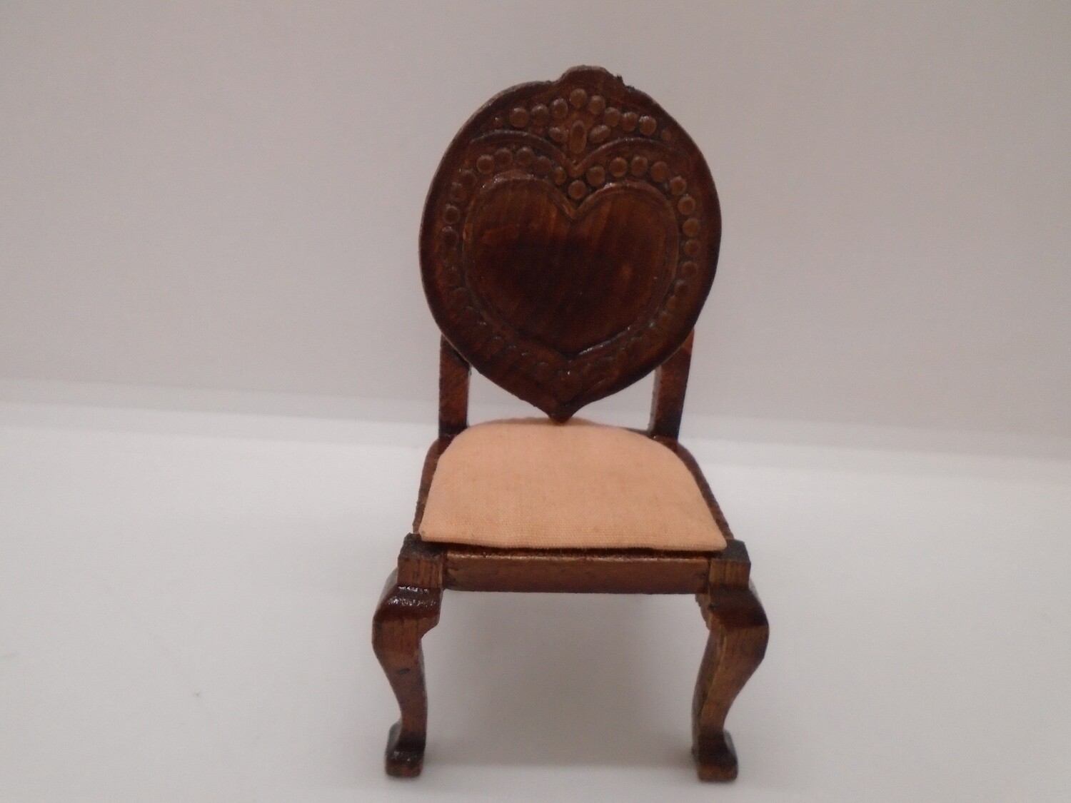 CARVED WOODEN CHAIR WITH  PEACH SEAT