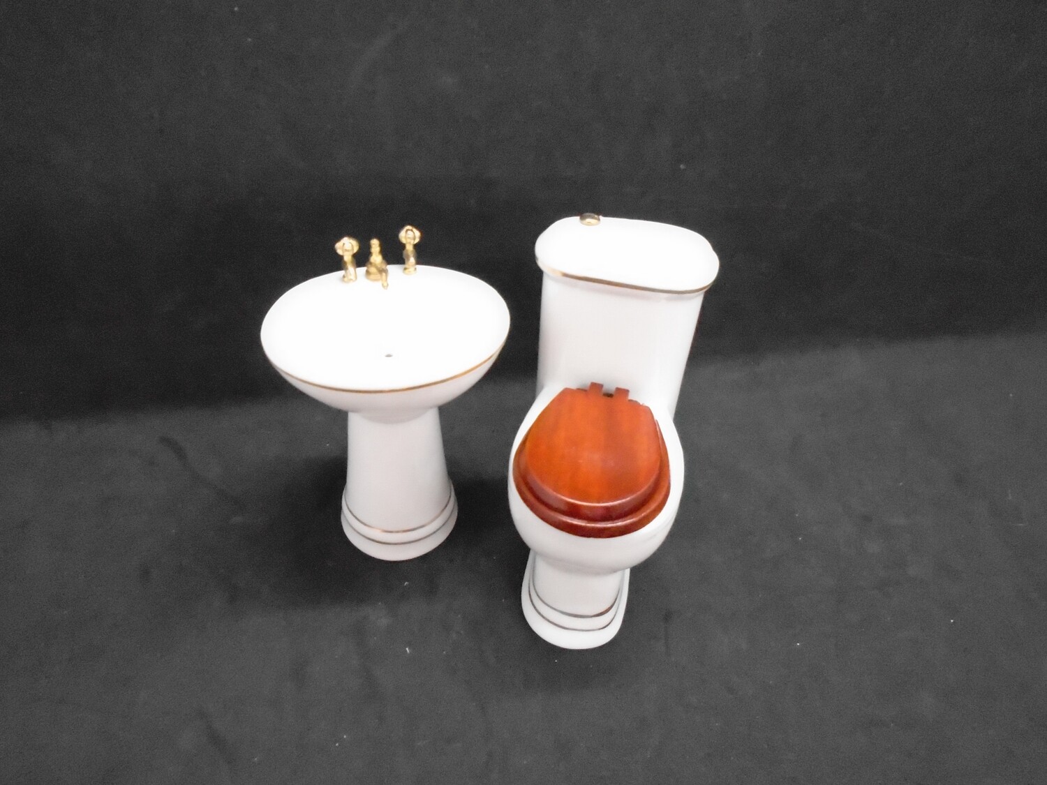 CHINA TOILET AND SINK WITH GOLD TRIM