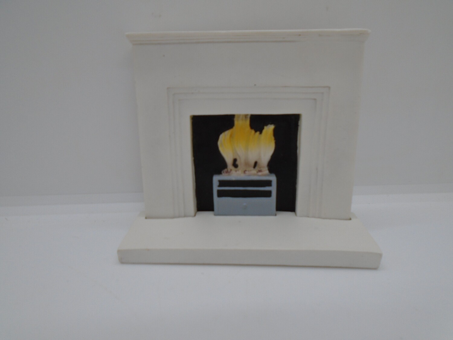 WHITE FIREPLACE AND FIRE