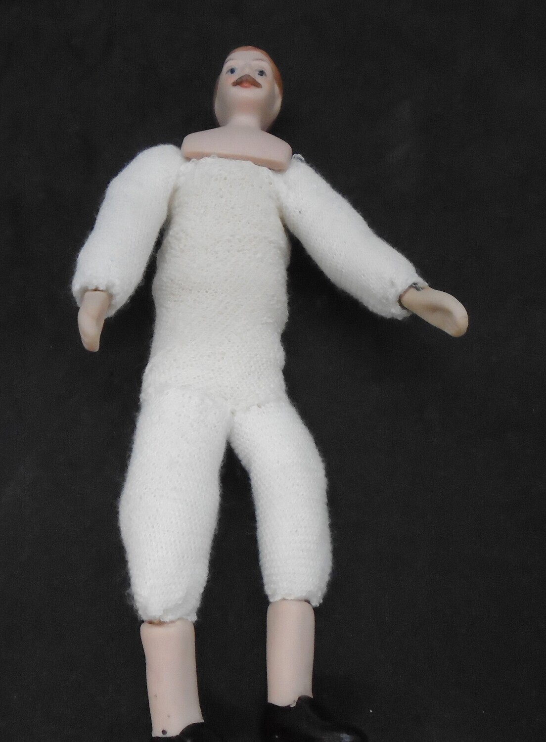 UNDRESSED MAN WITH MOUSTACHE