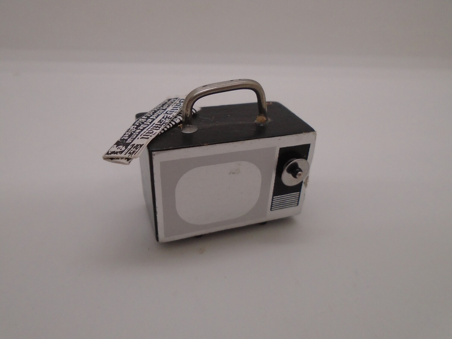 PORTABLE TV AND NEWSPAPER