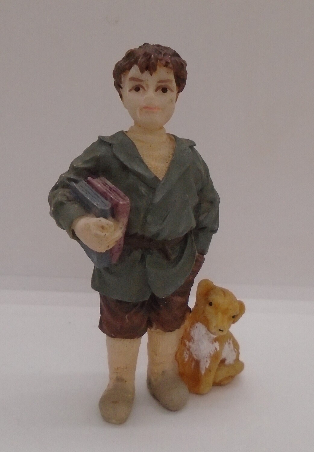 BOY CARRYING BOOKS WITH DOG