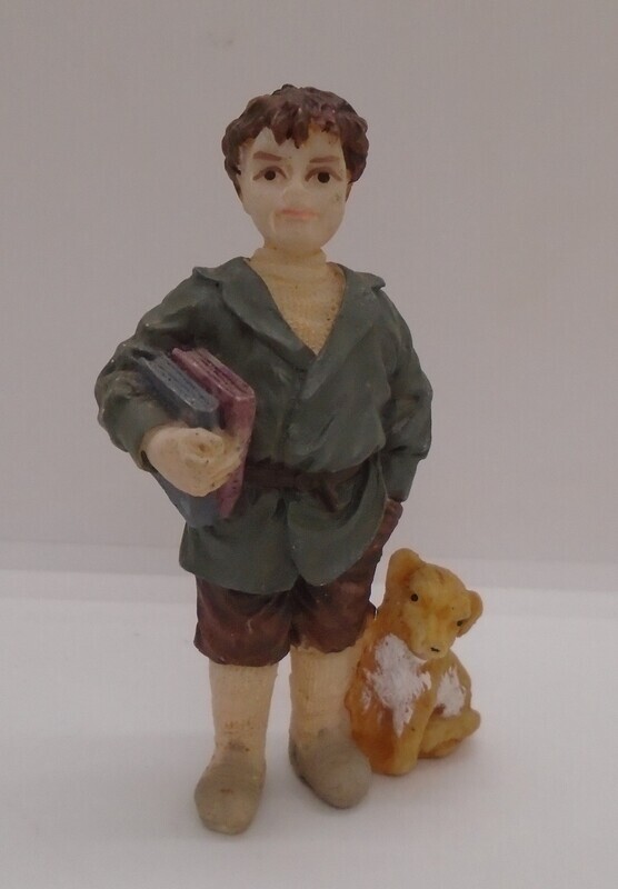 BOY CARRYING BOOKS WITH DOG