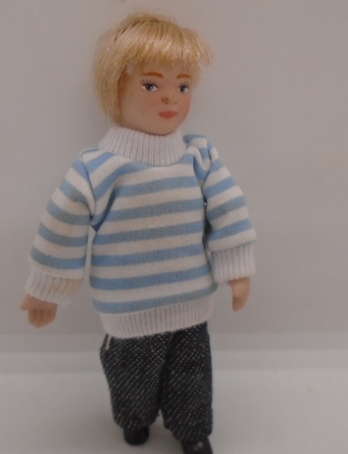 BLONDE MODERN BOY IN STRIPE JUMPER