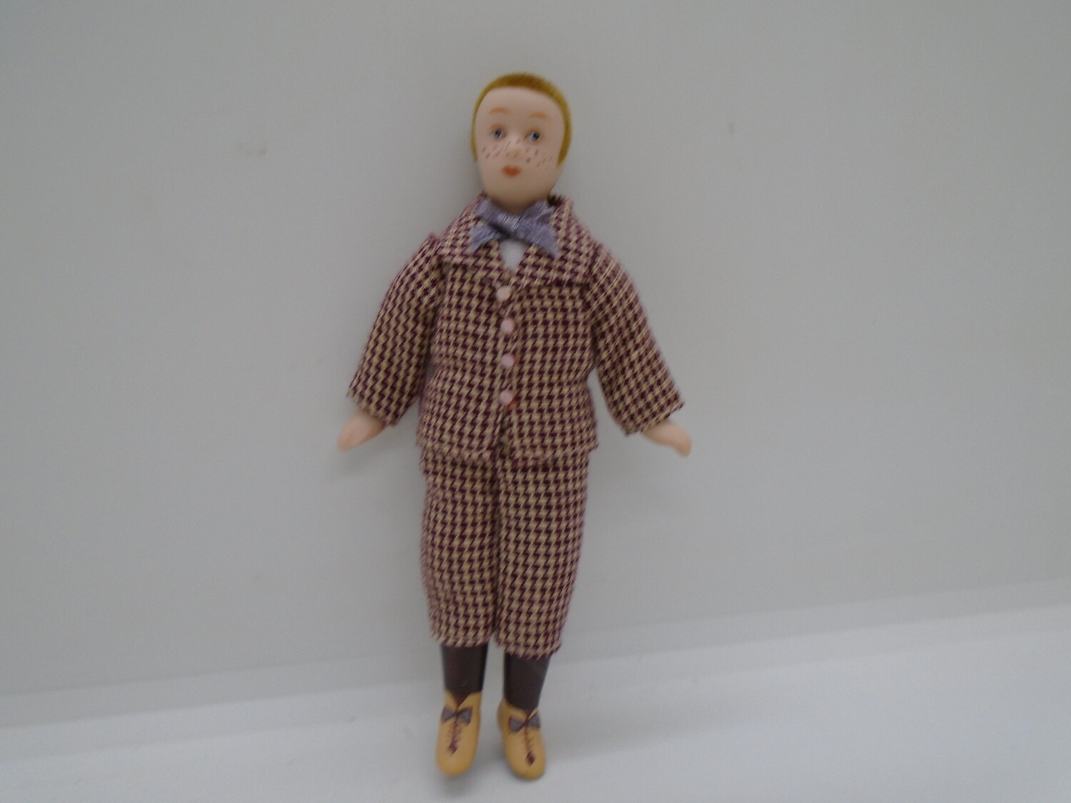 BOY IN BROWN DOGSTOOTH SUIT
