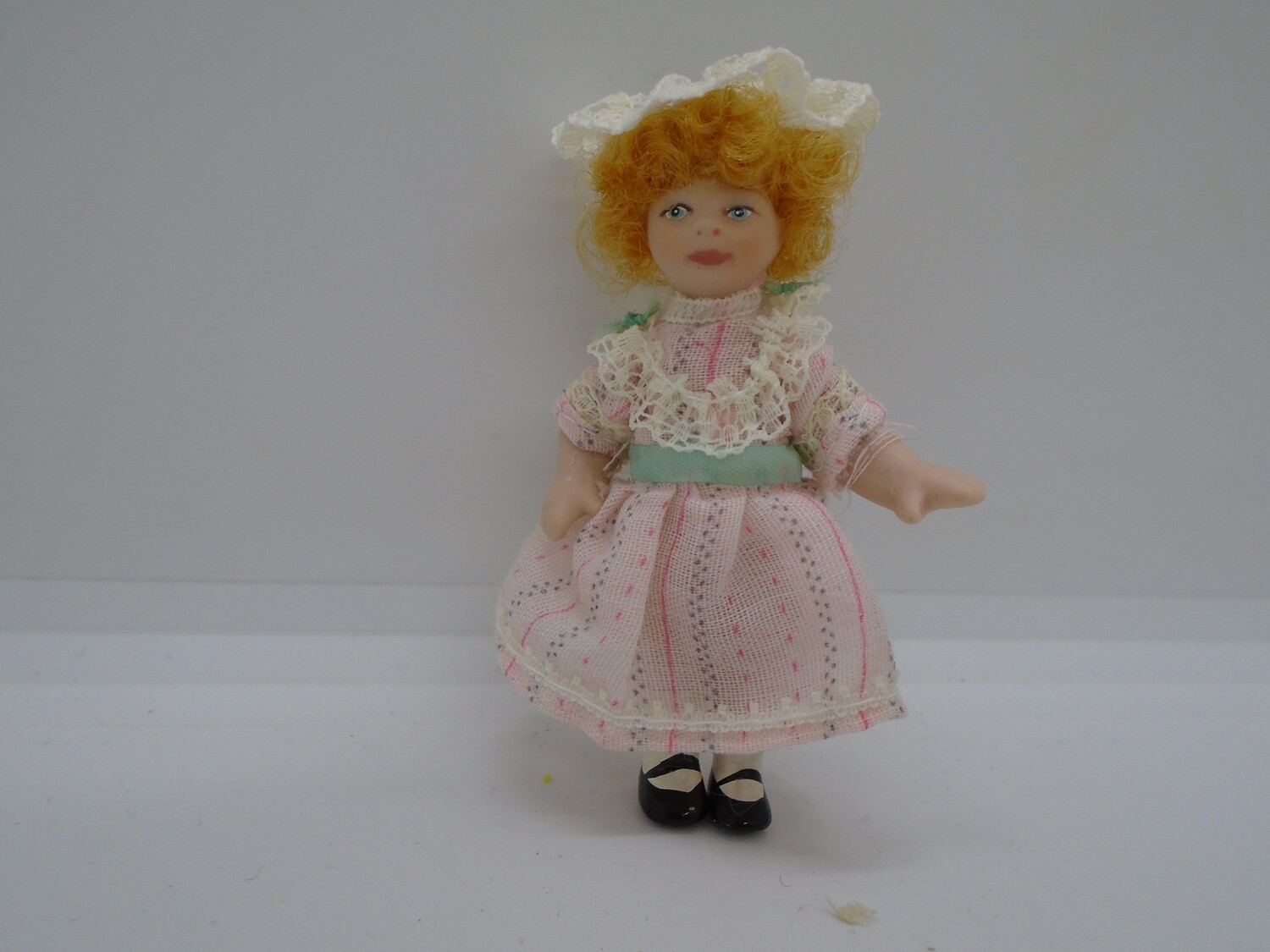 GIRL IN LACY PINK DRESS AND HAT