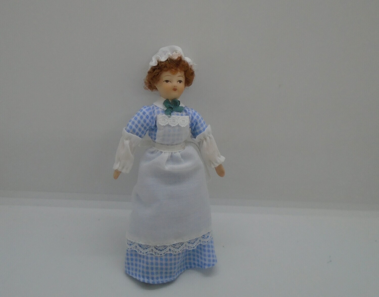 LADY/MAID IN BLUE CHECK
