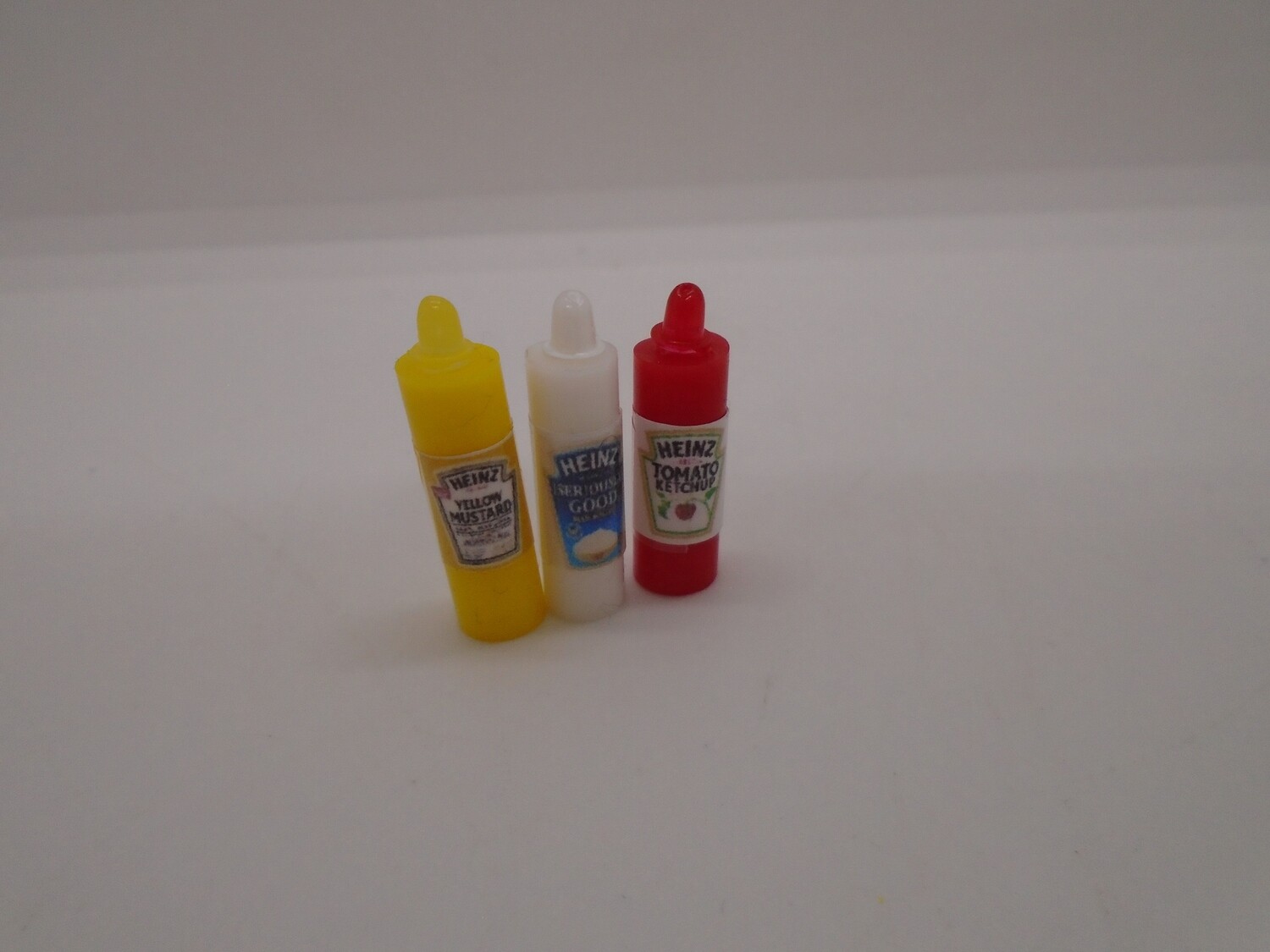BOTTLES OF SUACE,MAYO AND MUSTARD