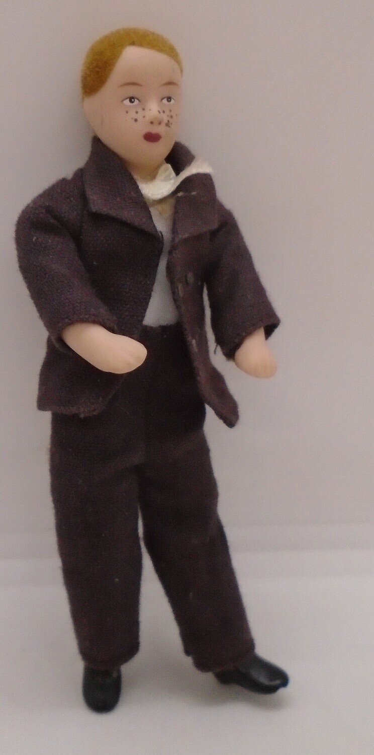 BOY IN BROWN SUIT