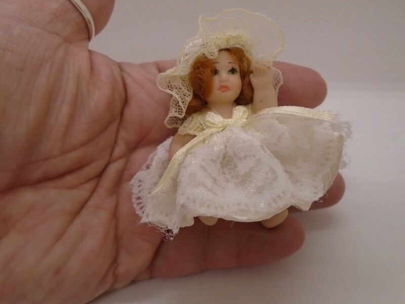 BABY GIRL IN WHITE WITH LEMON BOW