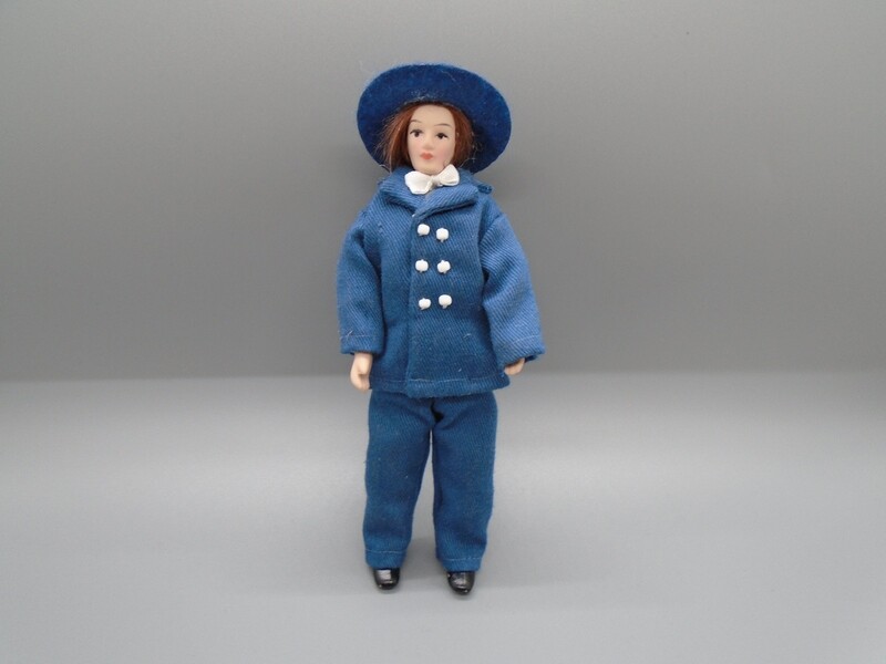 MAN IN BLUE SUIT WITH HAT