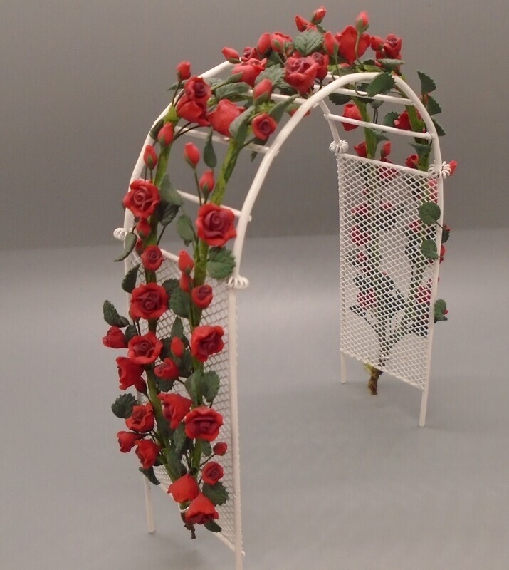 WHITE WIRED GARDEN ARCH WITH CLIMBING RED ROSES
