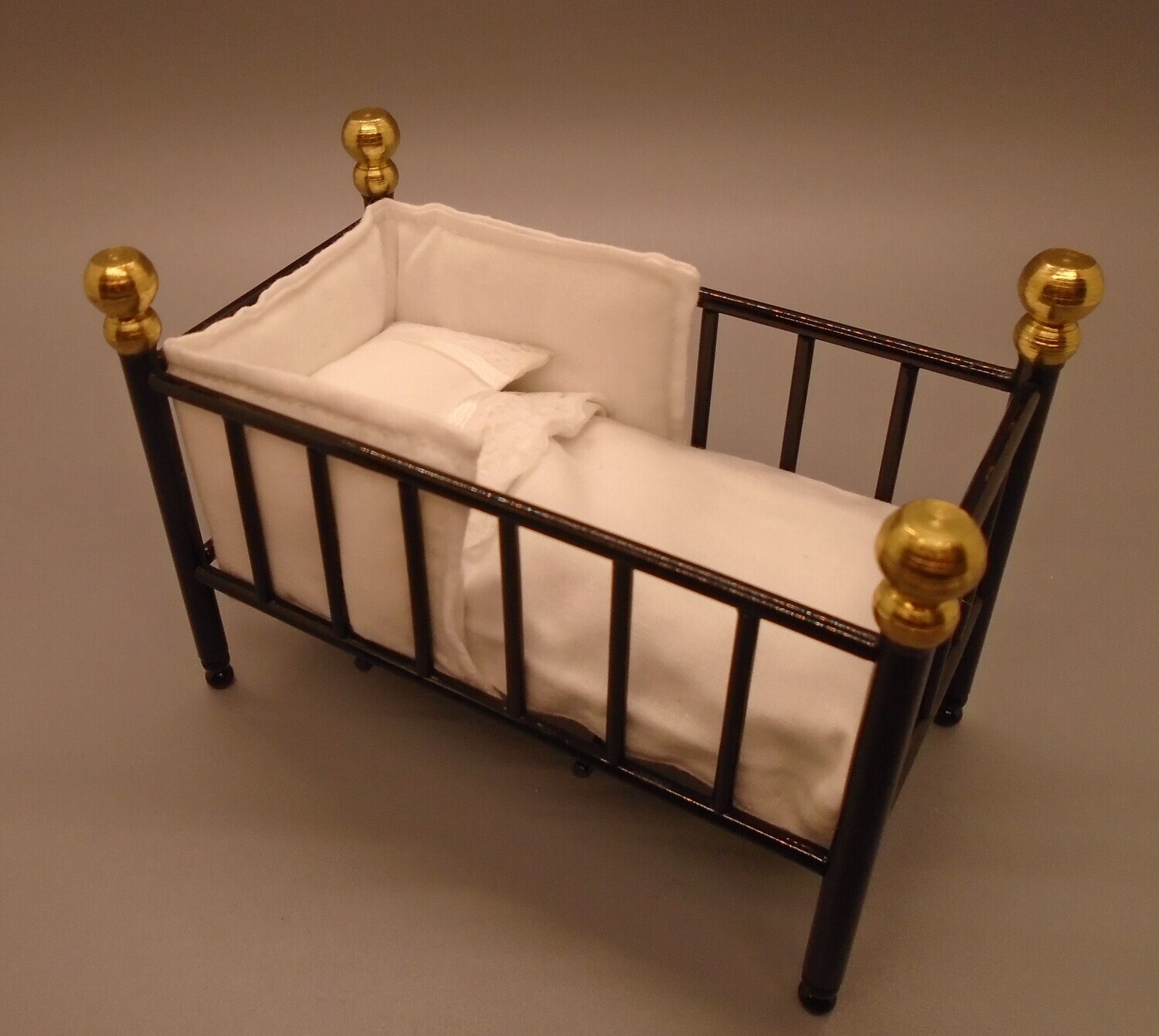 BLACK METAL COT WITH HAND CRAFTED BEDDING