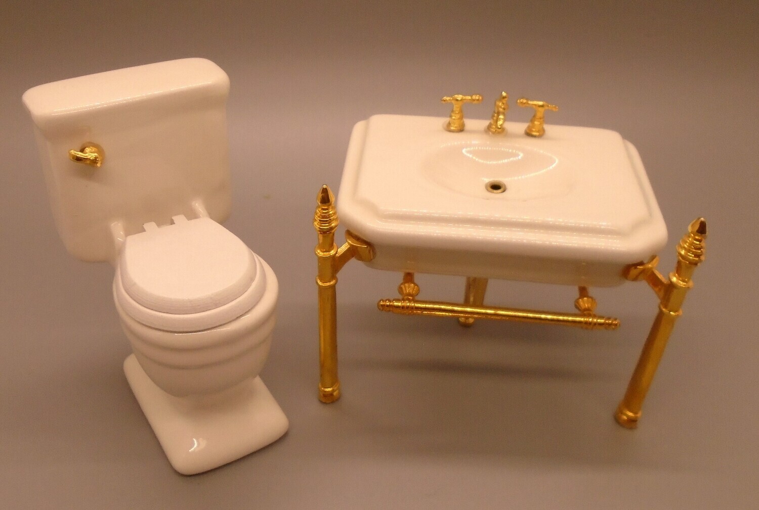 CHINA TOILET AND SINK WITH GOLD FITTINGS