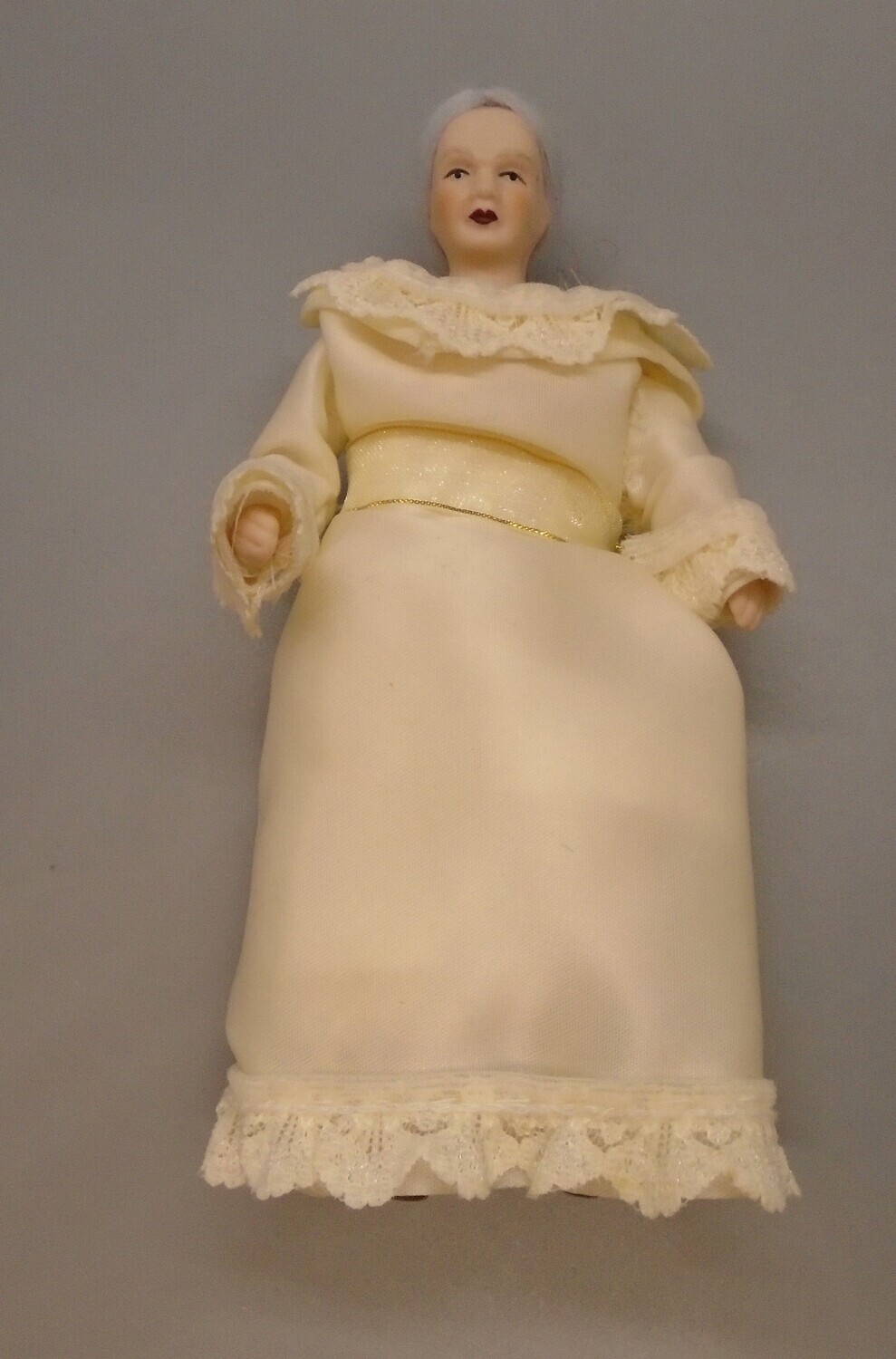OLDER LADY IN CREAM