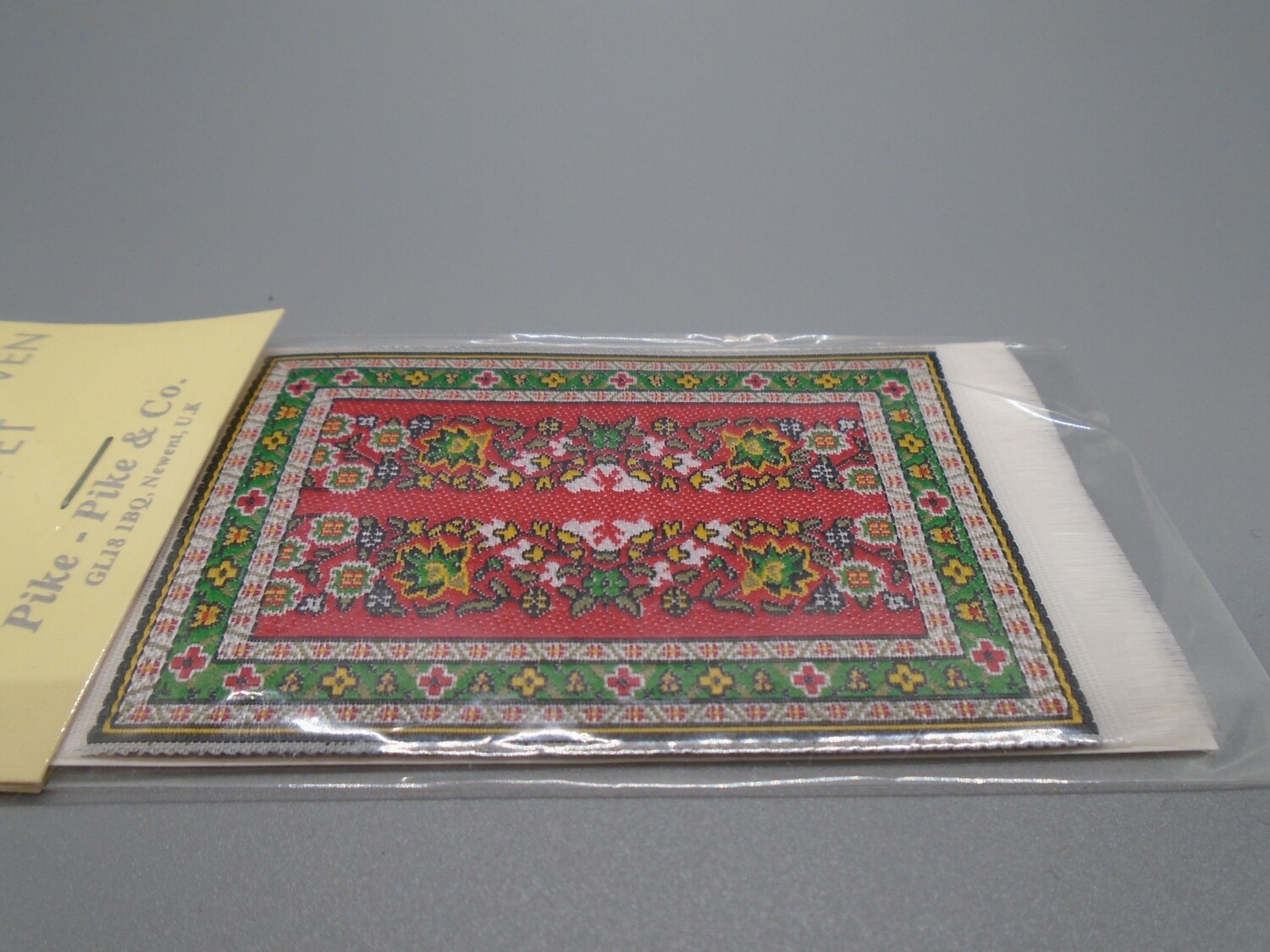 SMALL RED AND GREEN RUG