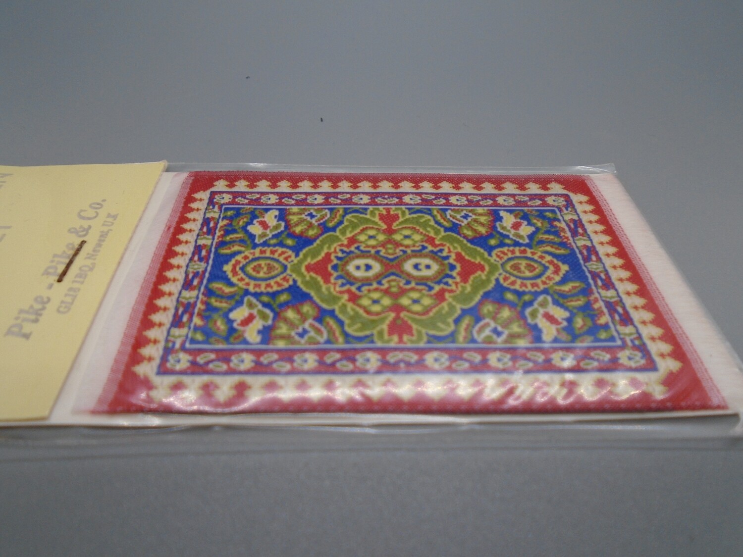 SMALL RED AND BLUE RUG