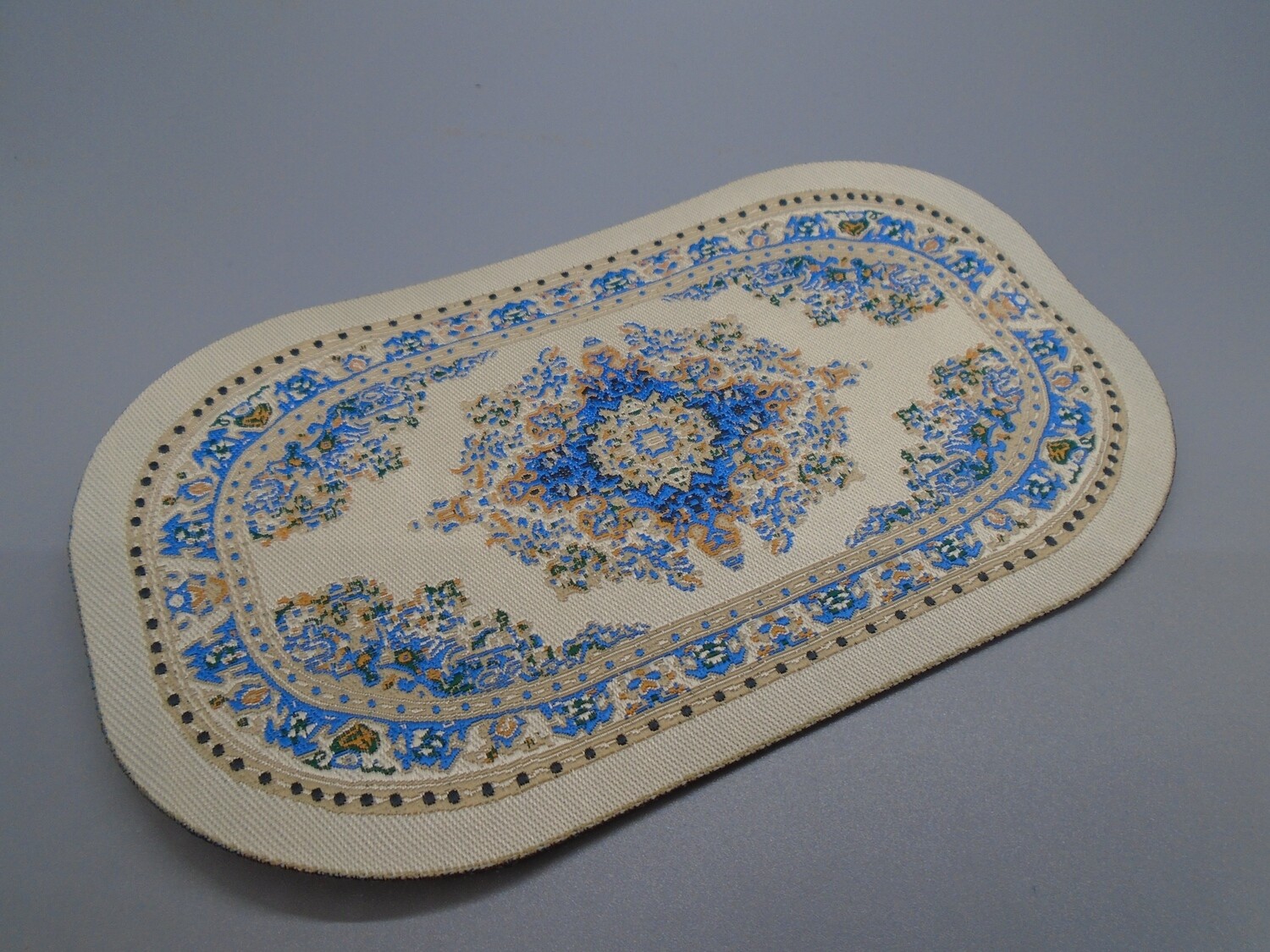 BLUE AND BEIGE OVAL CARPET