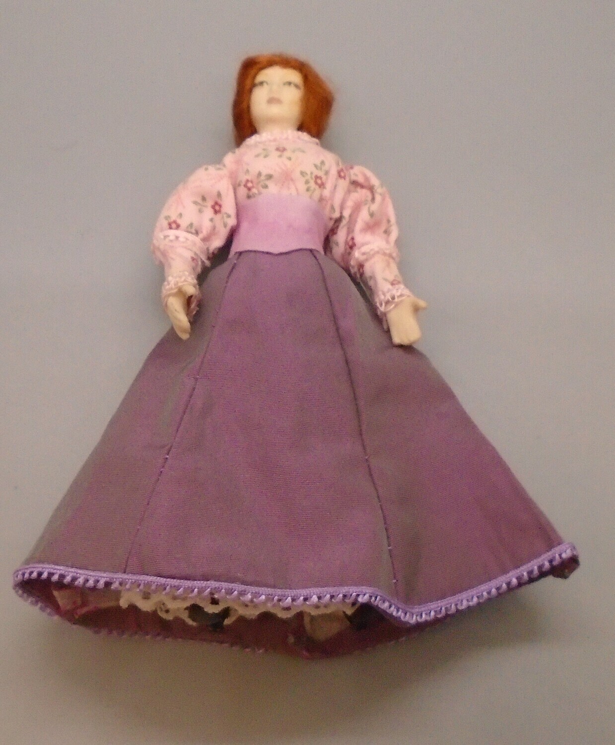 LADY IN DUSKY PINK SKIRT AND RED HAIR