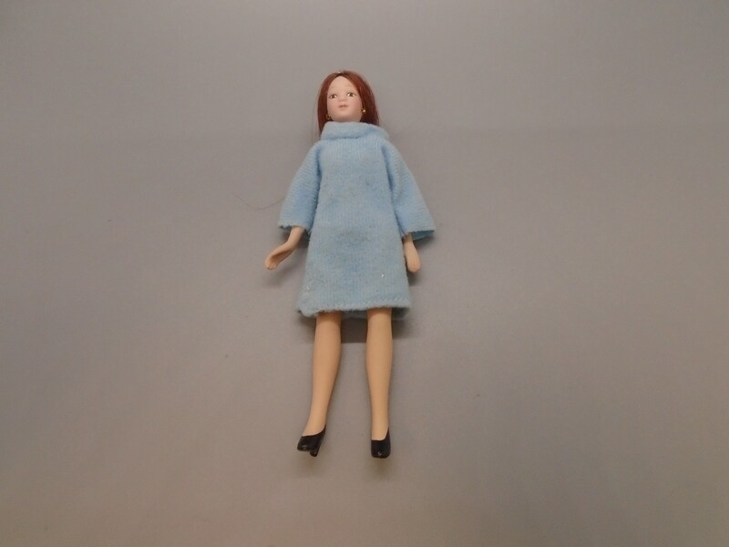 MODERN LADY IN BLUE DRESS WITH LONG HAIR