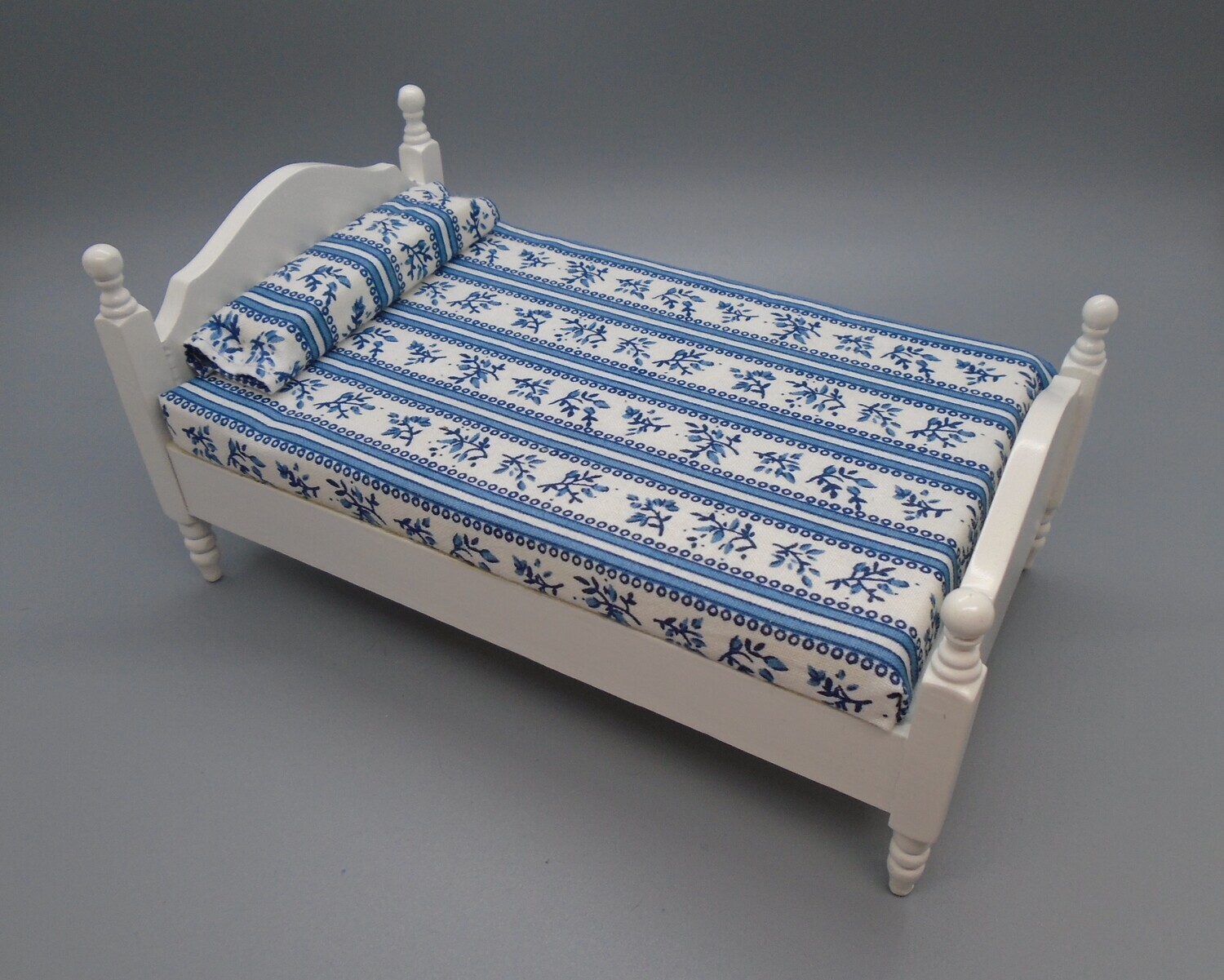 WHITE SMALL DOUBLE BED WITH BLUE BEDDING