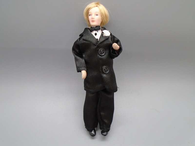 MAN IN BLACK SILK SUIT