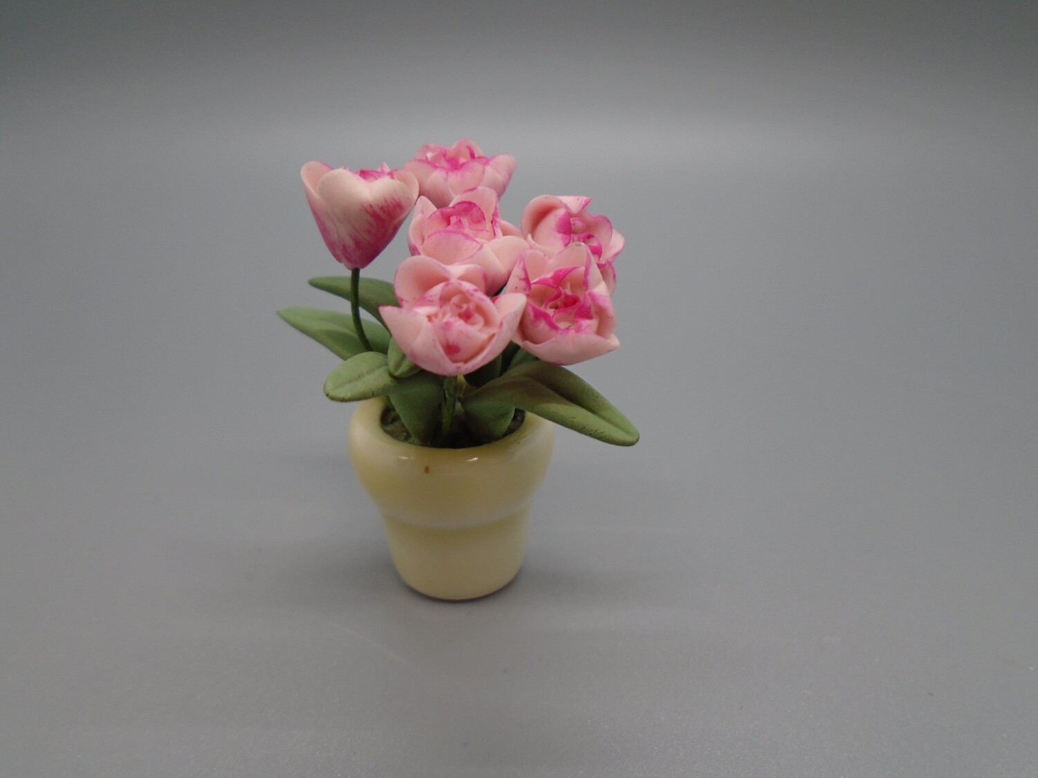 PINK FLOWERS IN CREAM POT