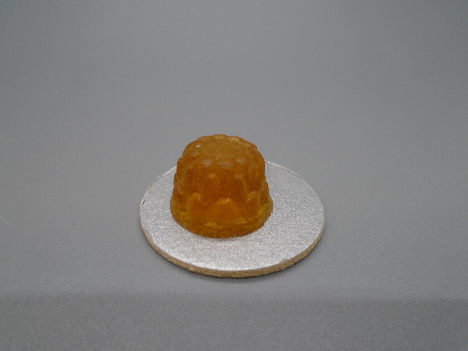 ORANGE JELLY ON SILVER PLATE