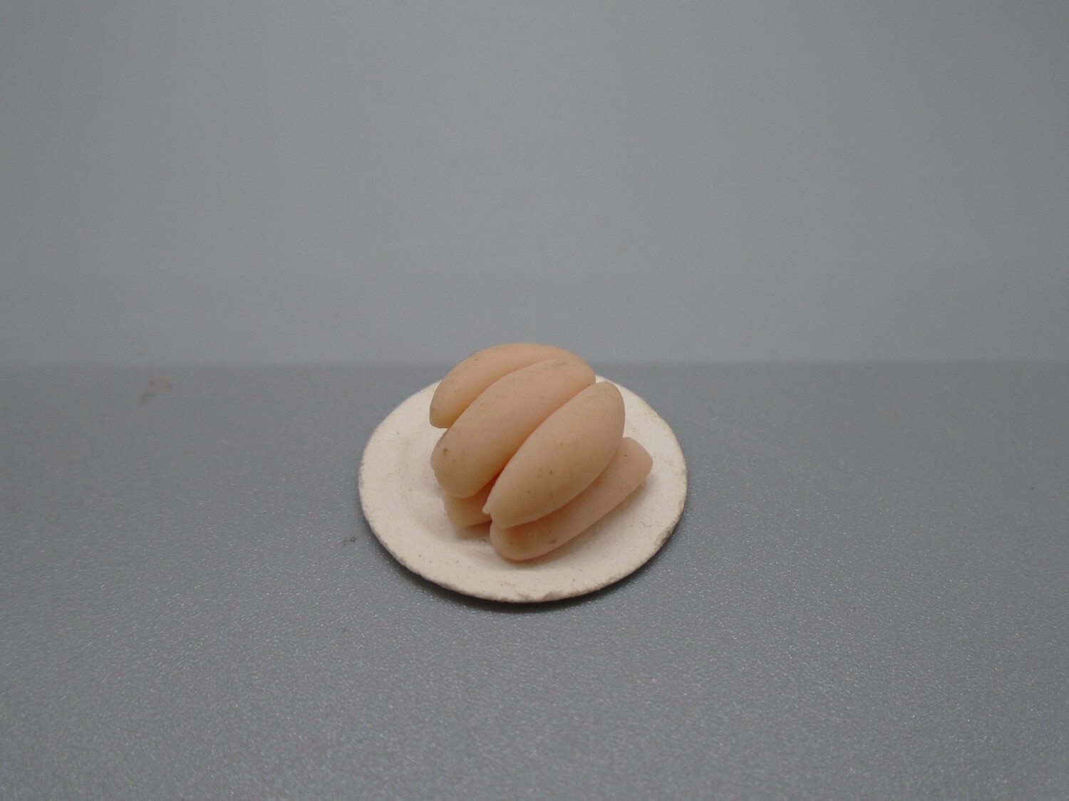 PLATE OF UNCOOKED SAUSAGES