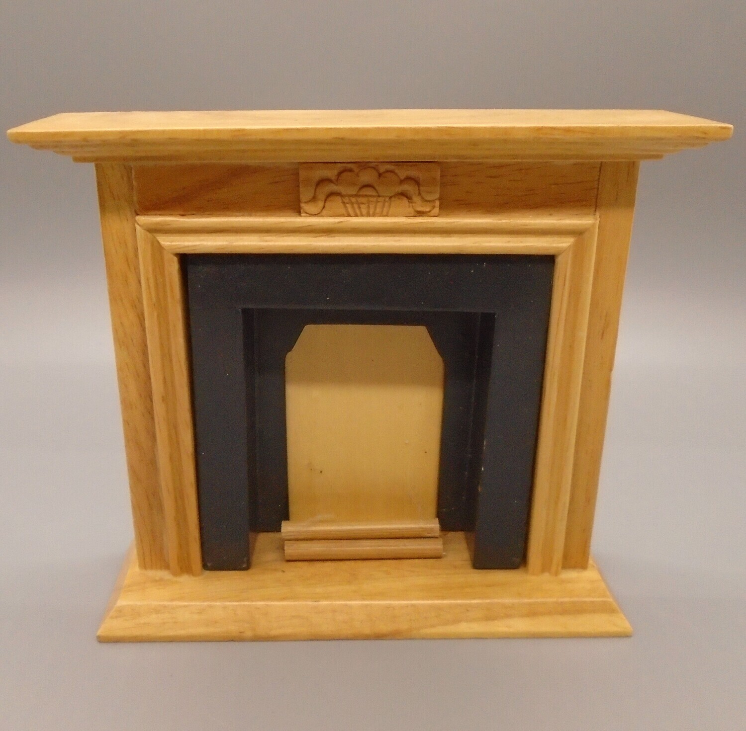 PINE FIRE PLACE WITH BLACK SURROUND