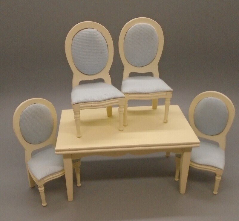 CREAM TABLE AND 4 CREAM AND BLUE CHAIRS