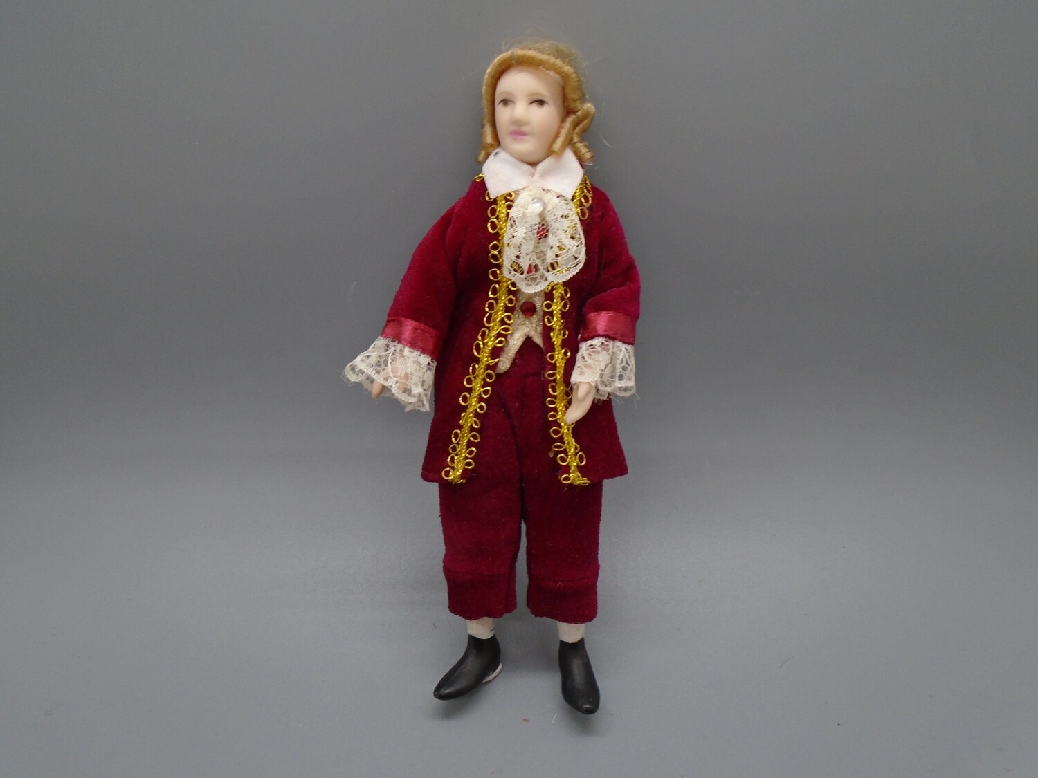 MAN IN RED, GOLD AND LACE