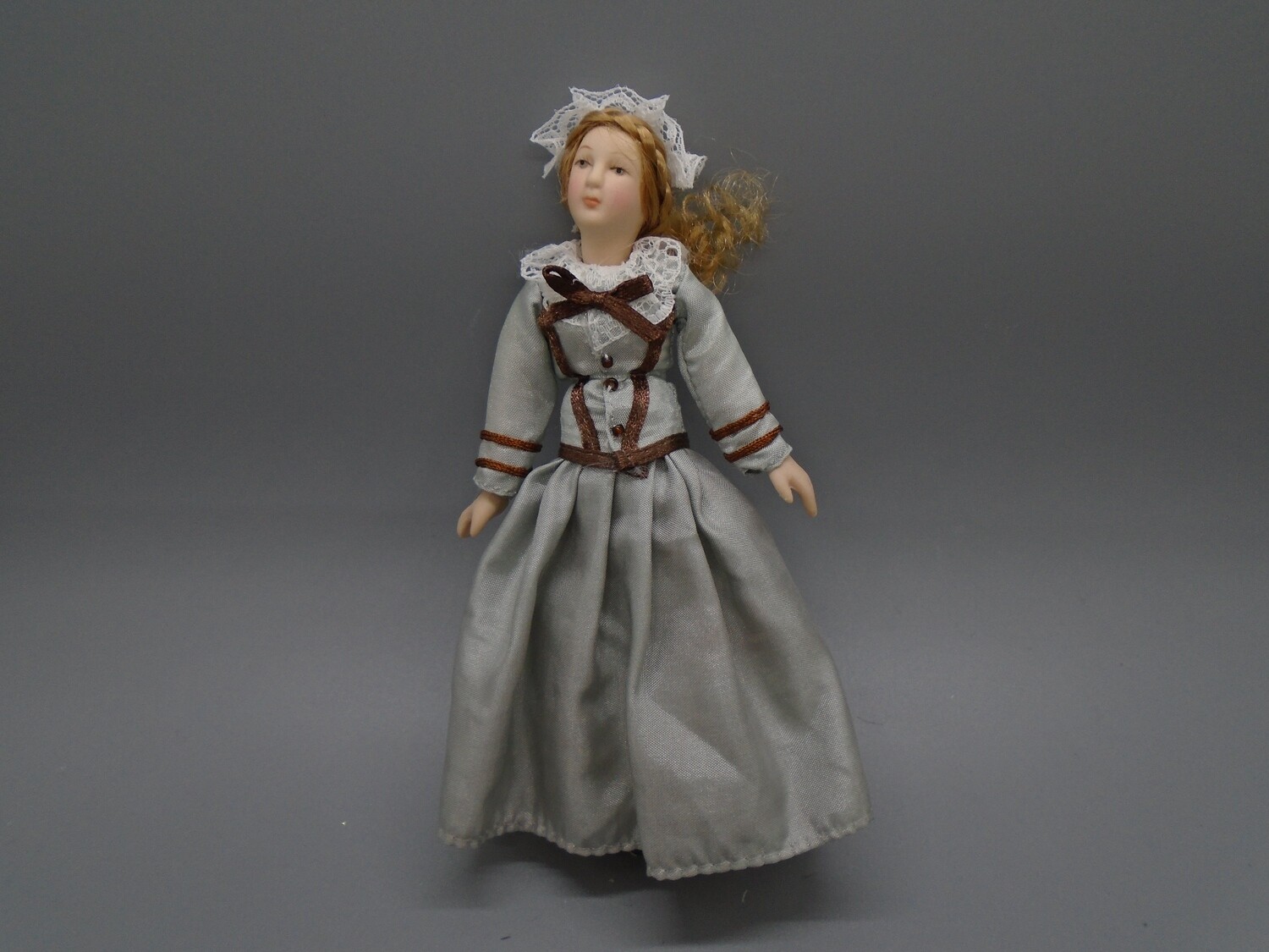 LADY IN GREY AND BROWN
